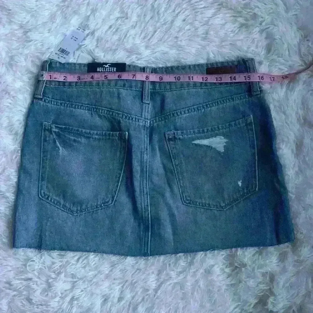 Hollister Denim Mini Skirt.  Size 9/waist 29.  Distressed w frayed edging. NWT.